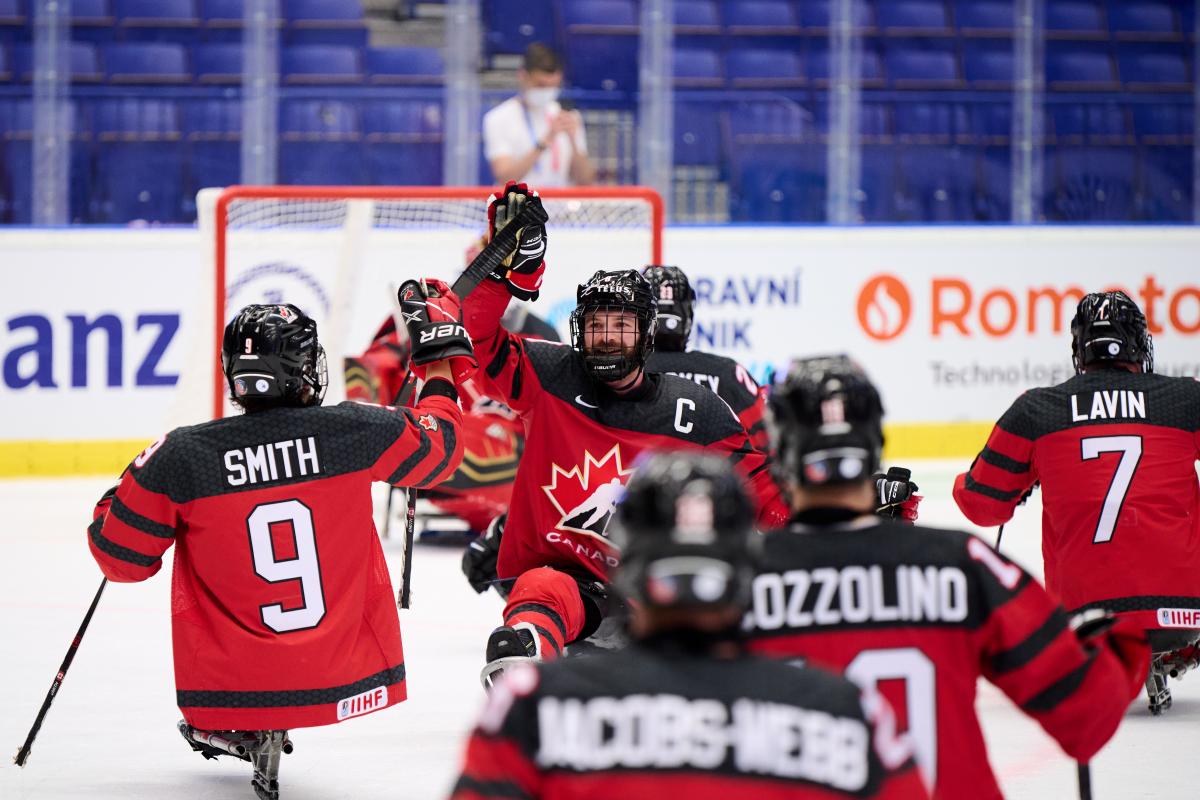 A group of Canadian Para ice hockey players celebrating