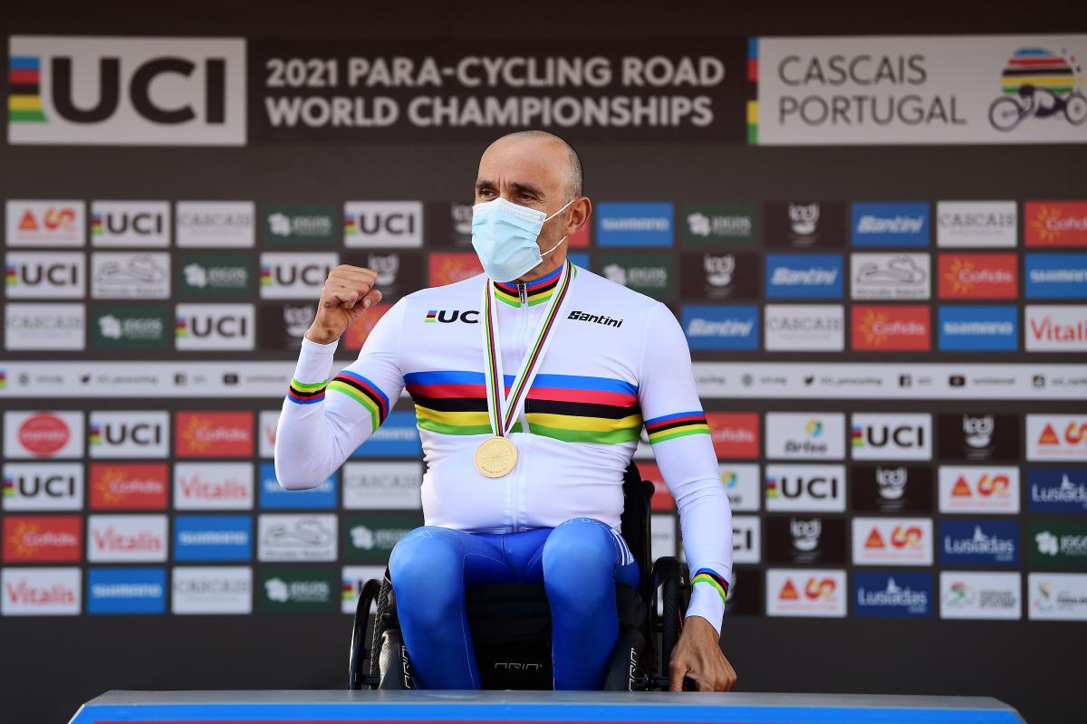 Italian Para cyclist Luca Mazzone in his wheelchair on the podium