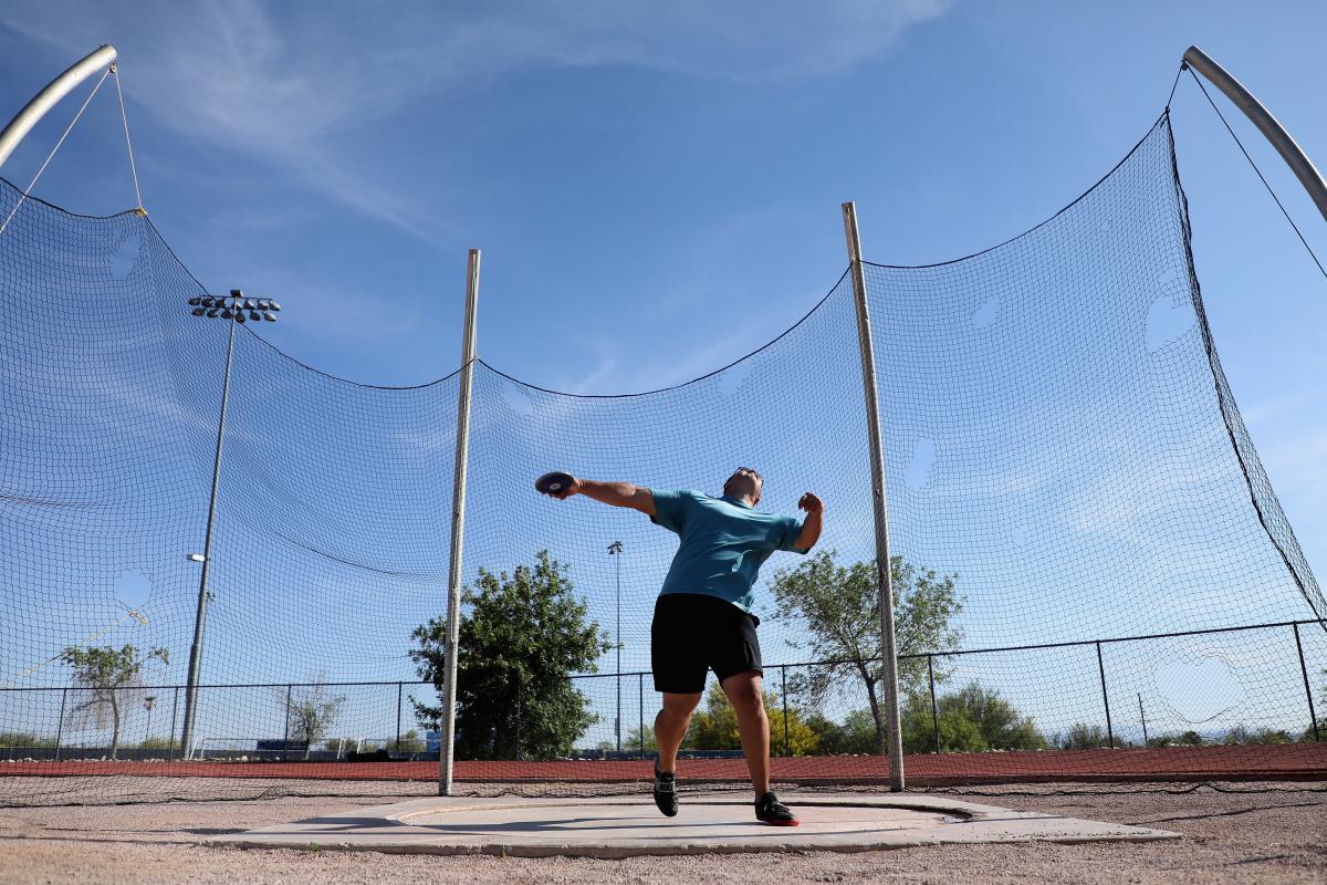 Refugee Para athlete Shahrad Nasajpour throwing the discus