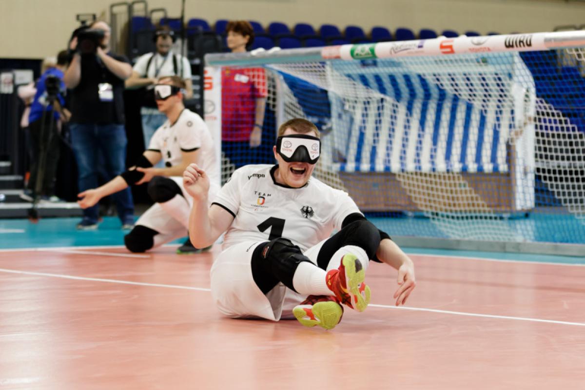 Male goalball player celebrates on the court