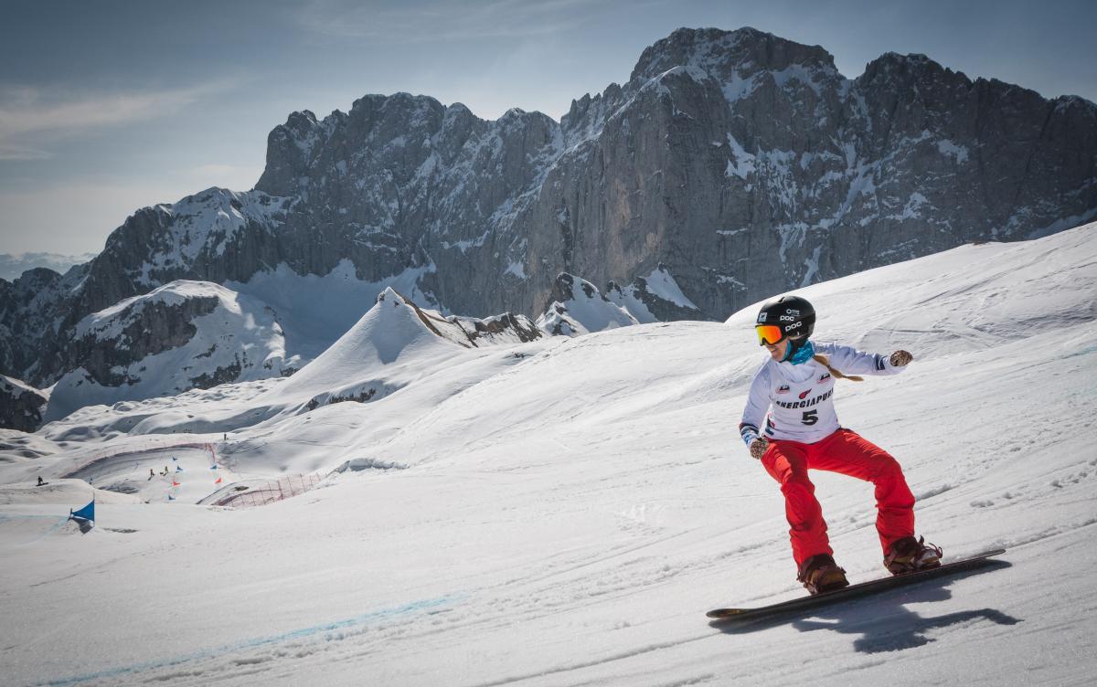 A female snowboarder in the snow