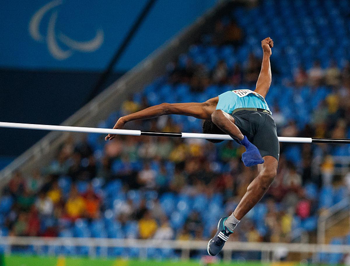 A man competing in the high jump 