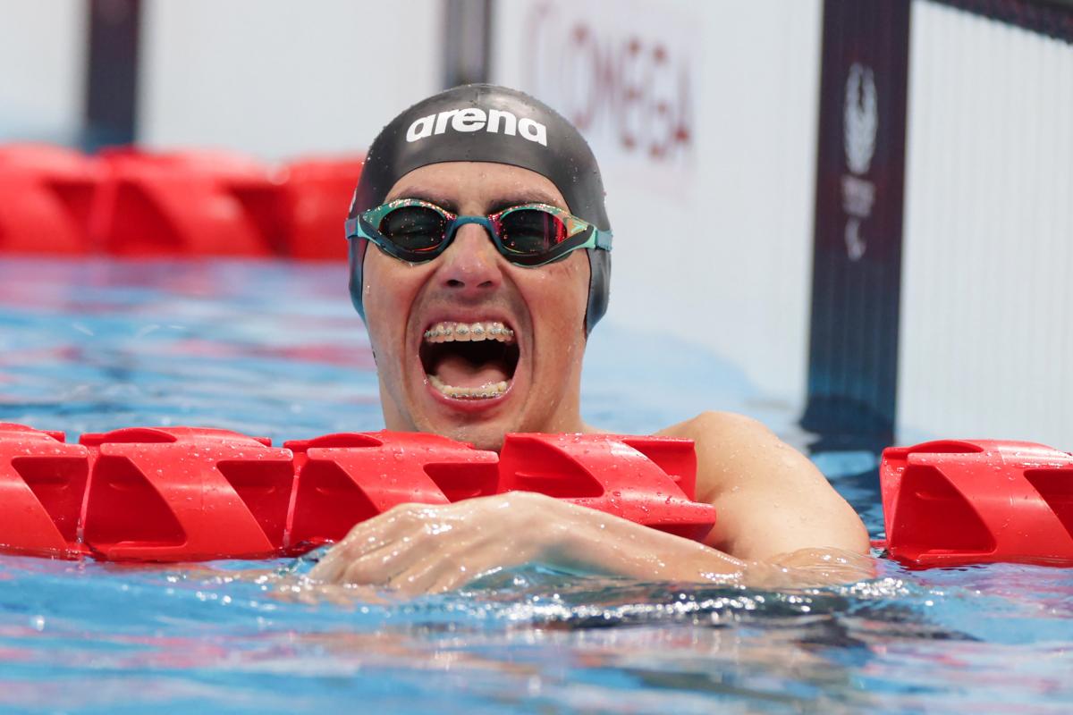 Chilean Alberto Abarza celebrates winning the celebrates winning the men's 100m backstroke S2