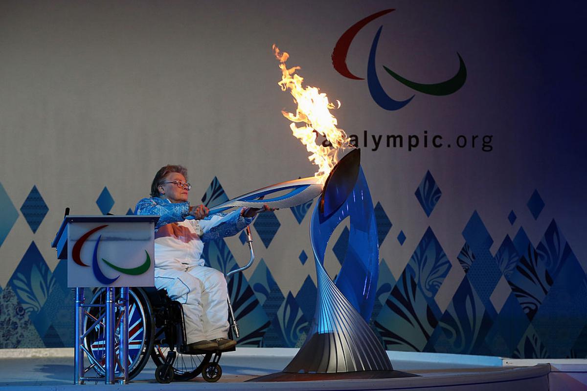 File photo of  Paralympian Caz Walton lighting the torch during the Paralympic Heritage Flame lighting ceremony at Stoke Mandeville Stadium in  England.