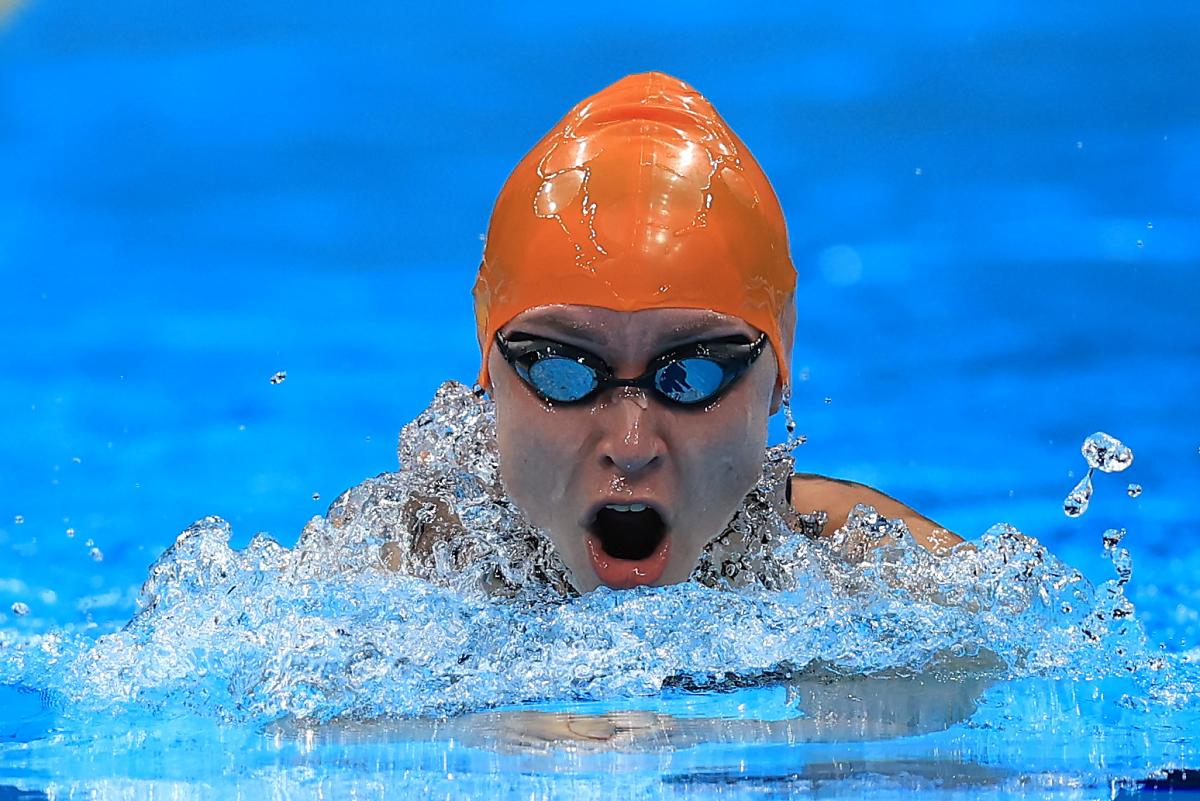 A woman swimming breaststroke