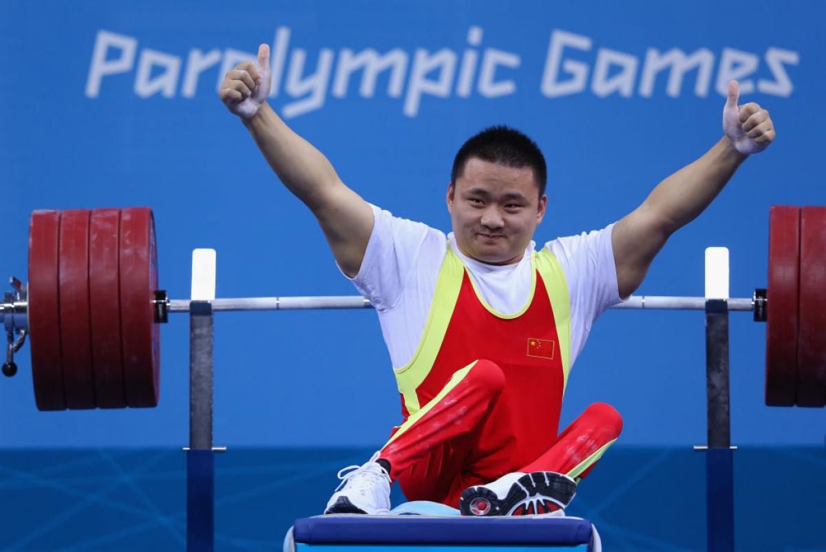 A picture of a man celebrating on a bench press
