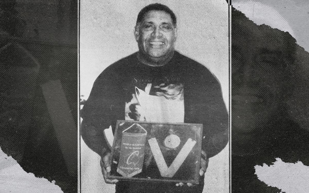 File photo of Harry Mosby with his medal from Toronto Games.