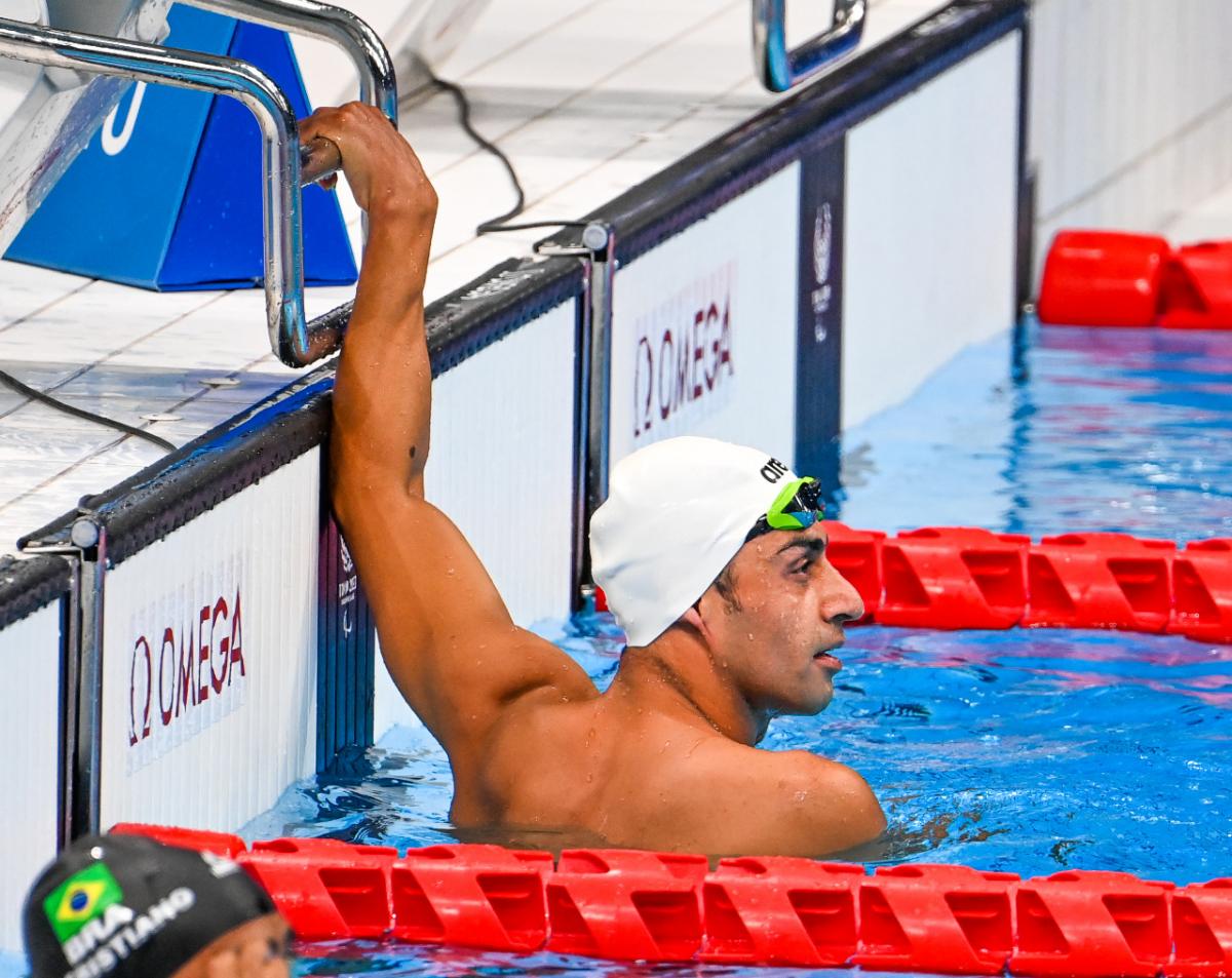 Refugee Paralympic athlete Ibrahim Al Hussein in the pool after a race