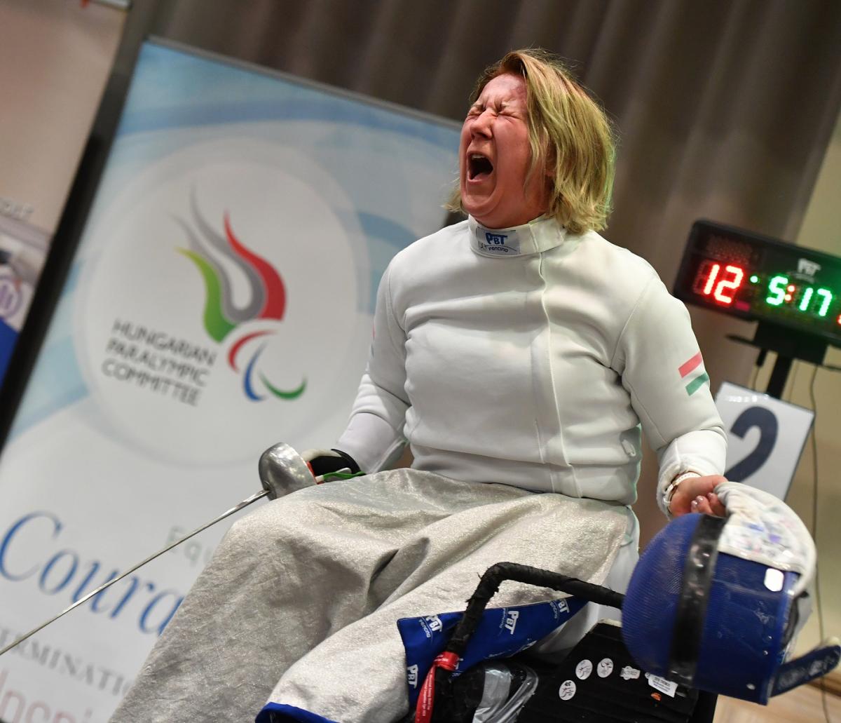 Hungarian wheelchair fencer Zsuzsanna Krajnyak celebrates