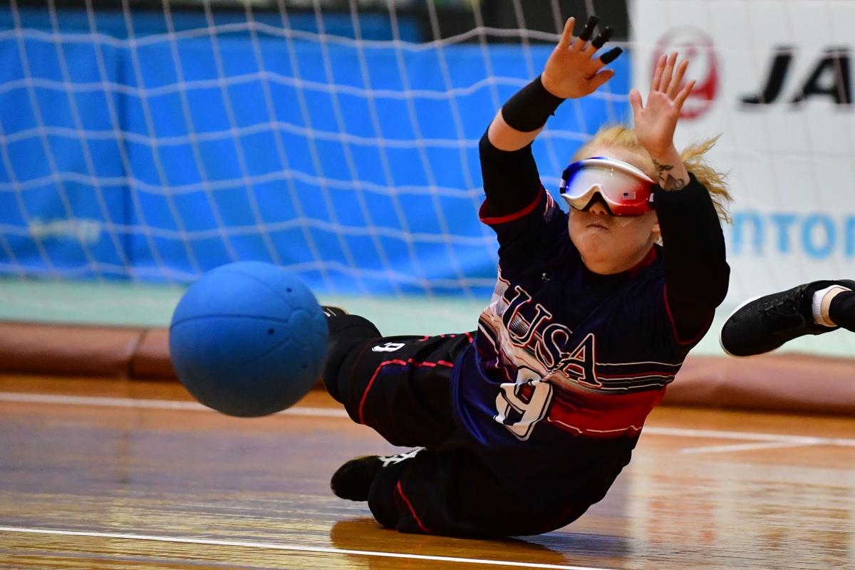 US goalball player Marybai Huking throws herself to the floor to prevent a ball from flying into the net