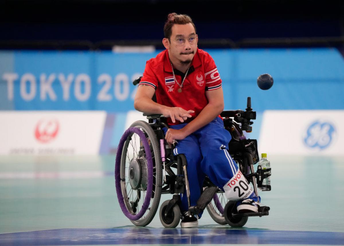 Watcharaphon Vongsa bites his lip in concentration as he throw the boccia ball