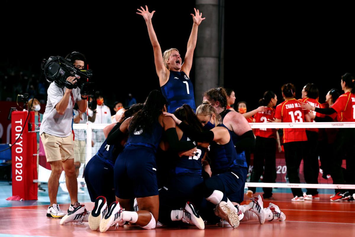 Team United States celebrate victory after winning the Women's Sitting Volleyball gold match against China at the Tokyo 2020 Paralympic Games.