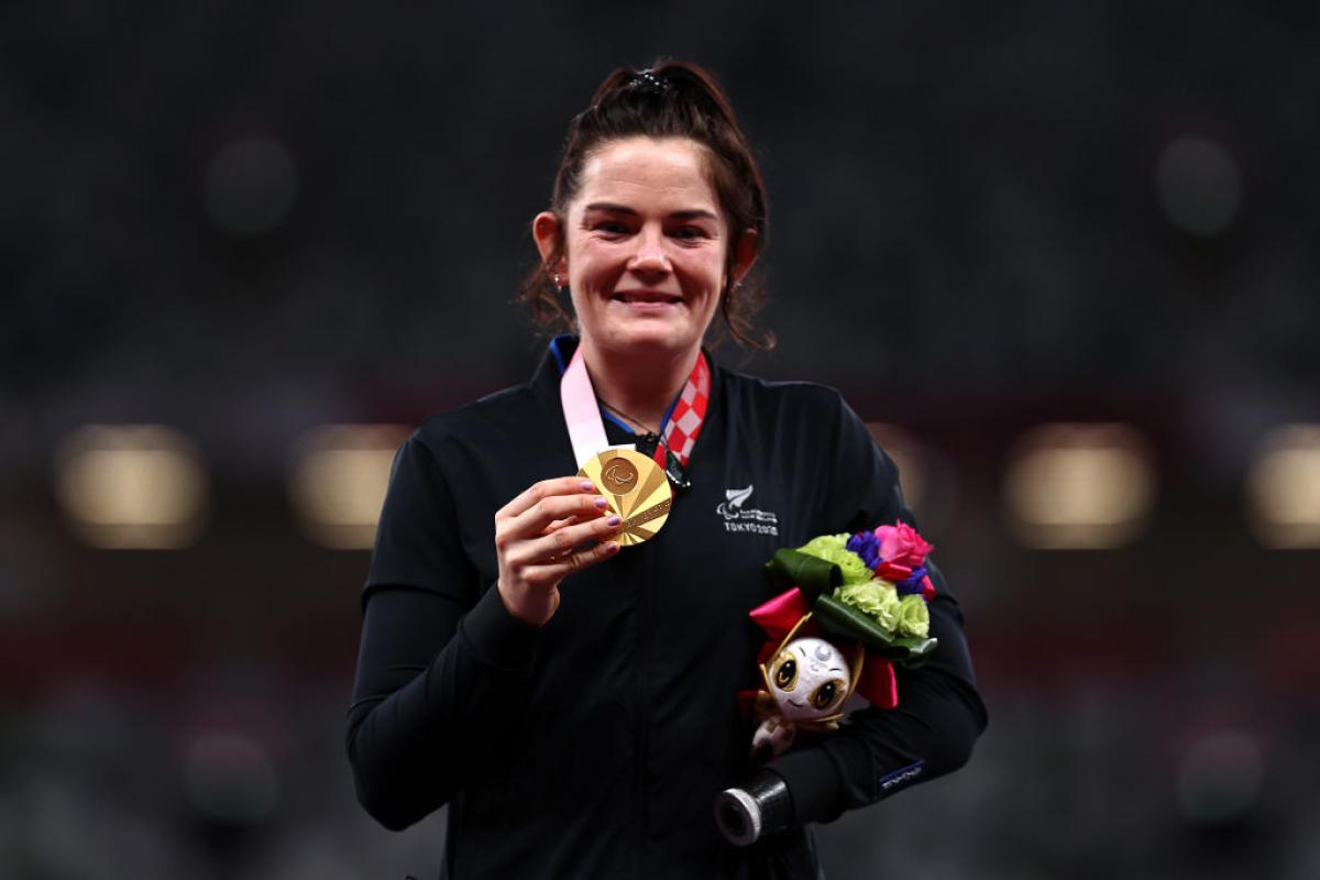 THE SMILE SAYS IT ALL: Holly Robinson of Team New Zealand poses with her gold medal after she competes in the women's javelin - F46 at the Tokyo 2020 Paralympic Games.