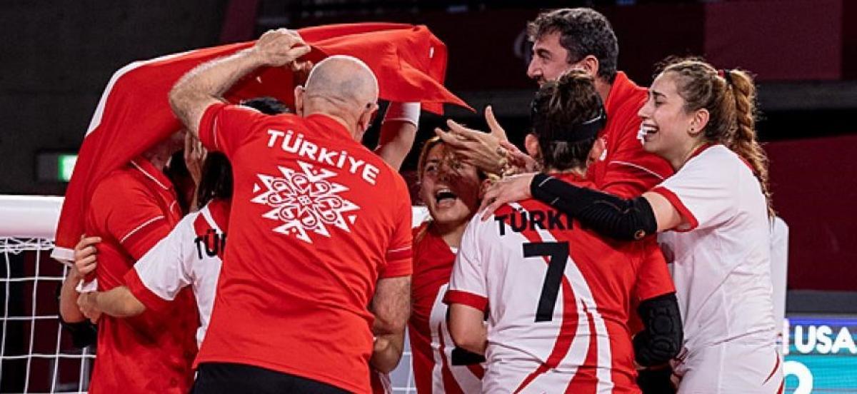 Turkish female goalball team celebrates after defending the Paralympic title in Tokyo.