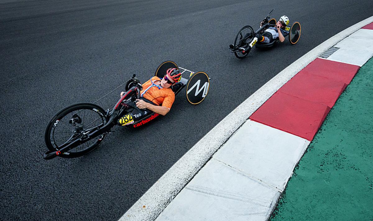 Two female handcyclists racing