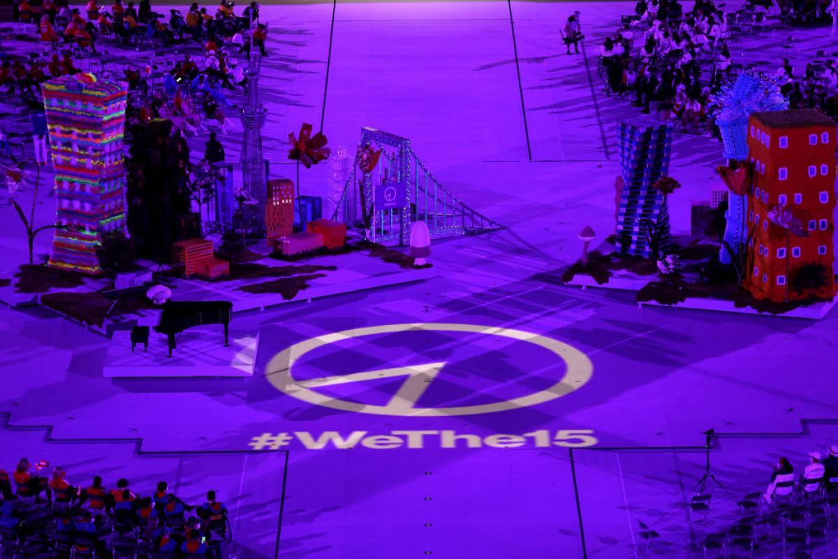 Wethe15 emblem lights up on the stage floor.