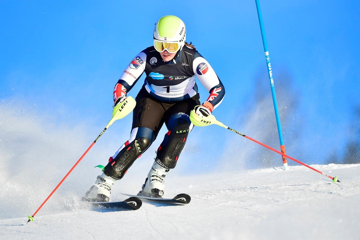 A female alpine skier in a slalom race