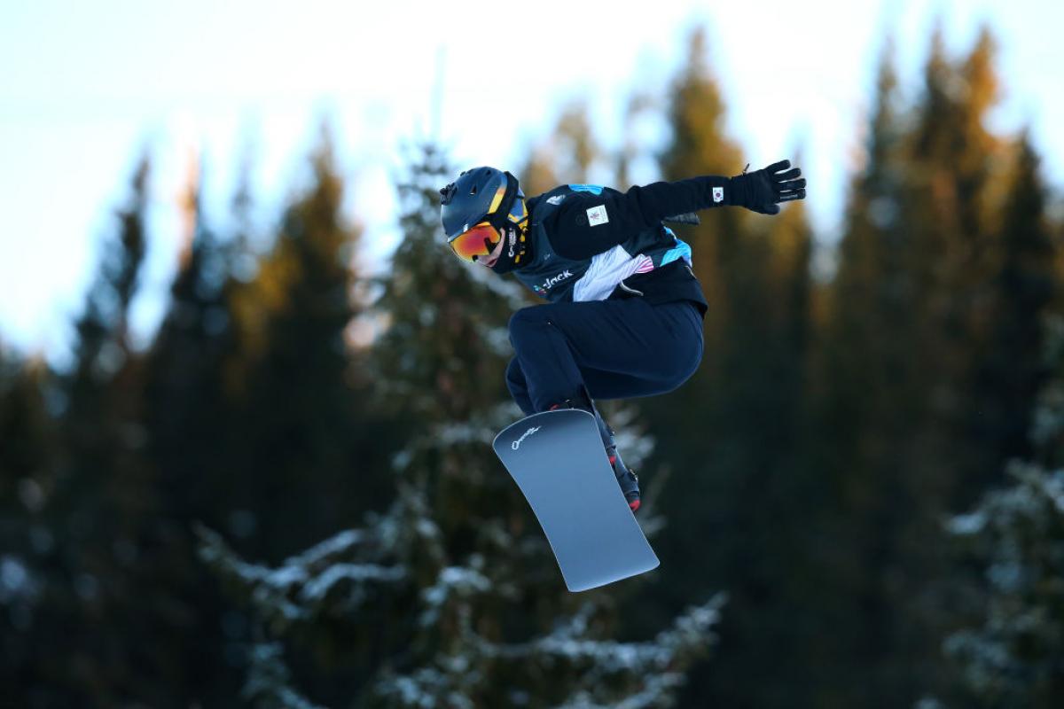 A male Para snowboarder during a competition 