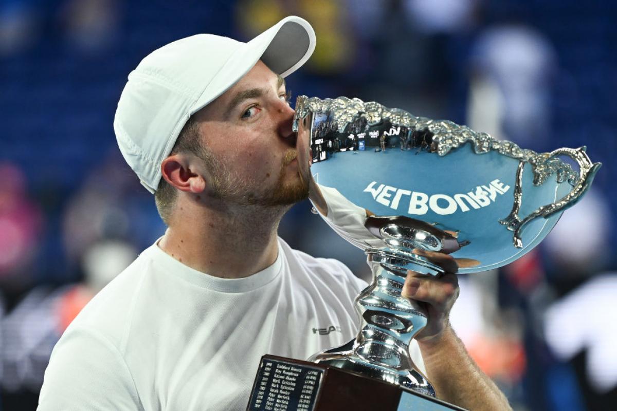 TASTE OF SUCCESS: Sam Schroder of Netherlands kisses the trophy after winning the Australian Open Quad Wheelchair Singles final against Dylan Alcott of Australia at Melbourne Park. 