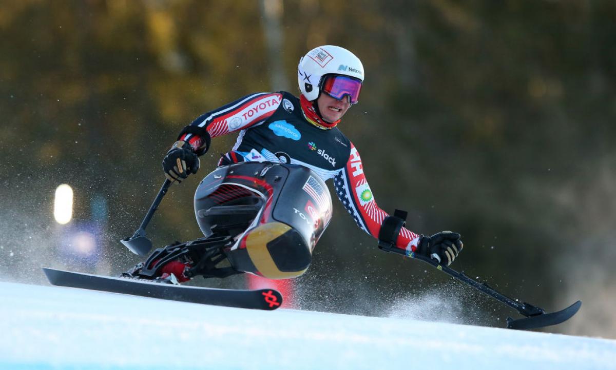 A male sit skier in a Para alpine skiing competition