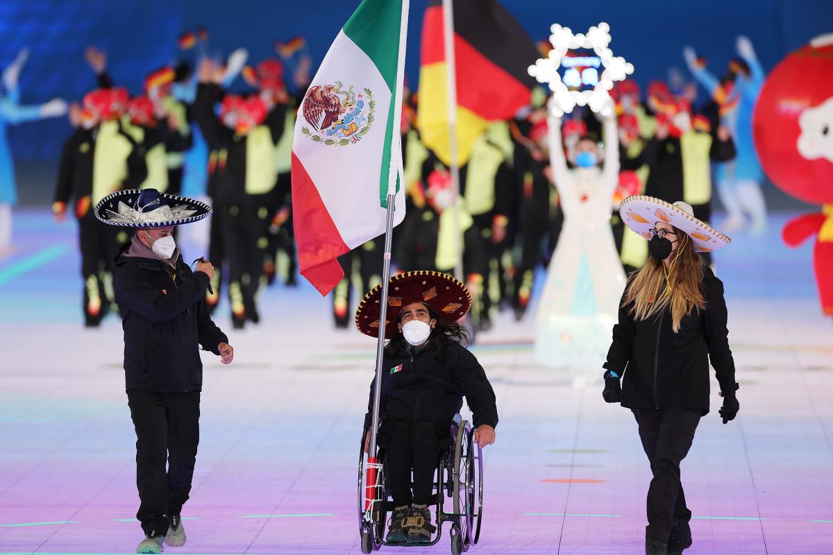 Arly Velasquez carries the Mexican flag at the Opening Ceremony of Beijing 2022
