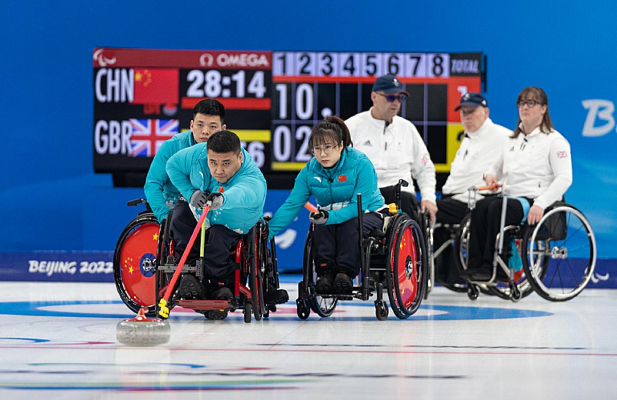 A Chinese wheelchair curler releases the stone