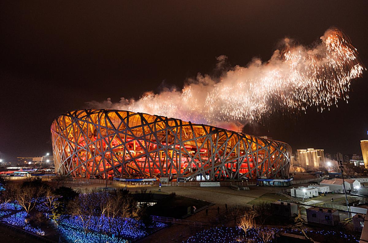 Fireworks emerge from the top of the Birds Nest National Stadium with its metal exoskeleton during the closing ceremony of Beijing 2022