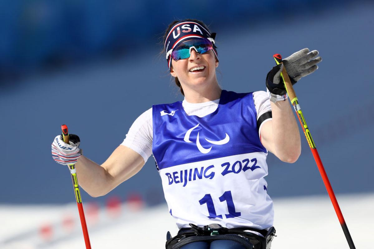GOLDEN RUN: Kendall Gretsch of United States reacts after winning the Para Biathlon Women's Middle Distance Sitting at the Beijing 2022 Winter Paralympics.  
