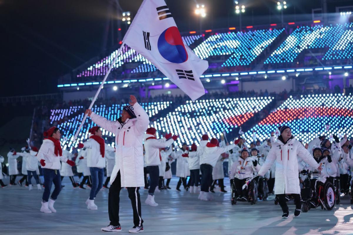 Flag bearer Sin Eui Hyun of South Korea leads the team during the Opening Ceremony of the PyeongChang 2018 Paralympic Winter Games.