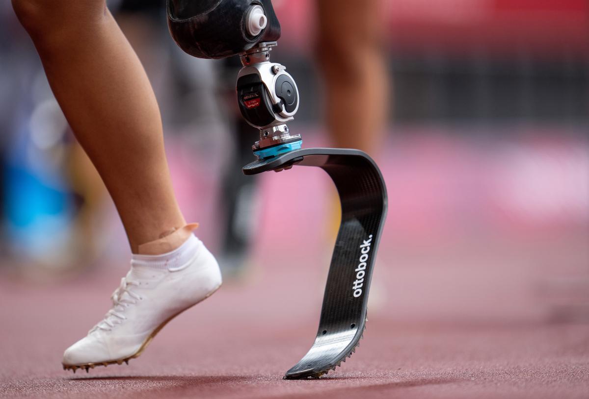 The foot and blade of an athlete in the Olympic Stadium track at the Tokyo 2020 Paralympic Games.