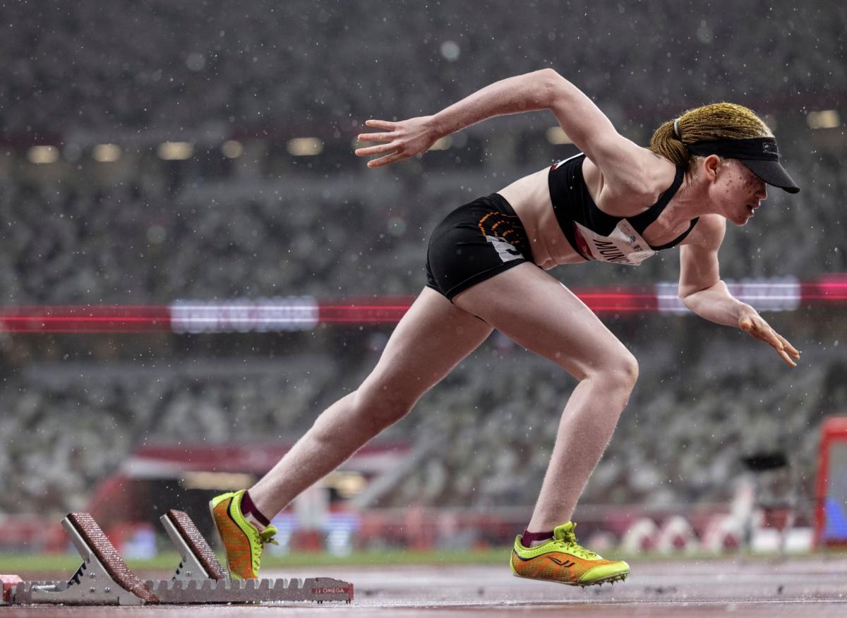 Monica Munga blasts out of the starting blocks on a rainy race day at the Tokyo 2020 Paralympic Games.