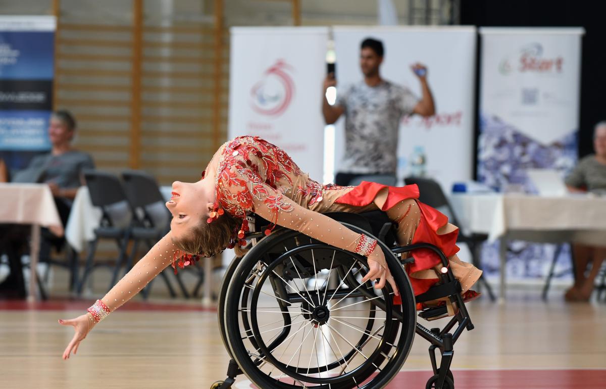 Image of a female dancer in her wheelchair