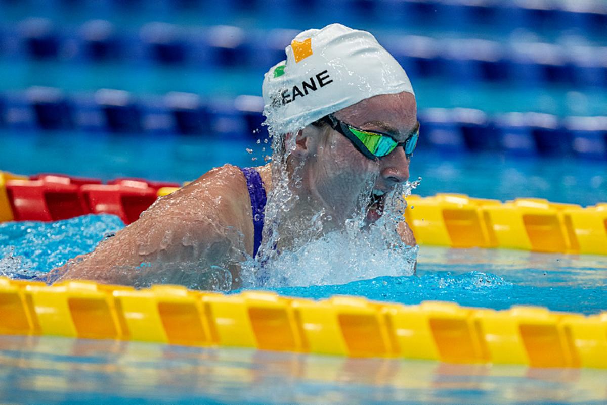 A female swimmer swimming breaststroke