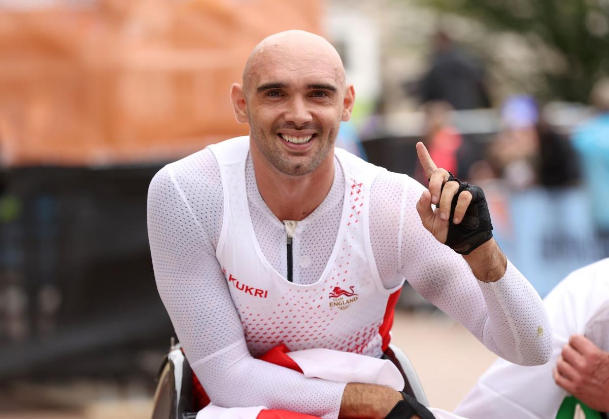 England's Johnboy Smith crossed the finishing line in one hour 41.15 minutes for his first CWG gold.