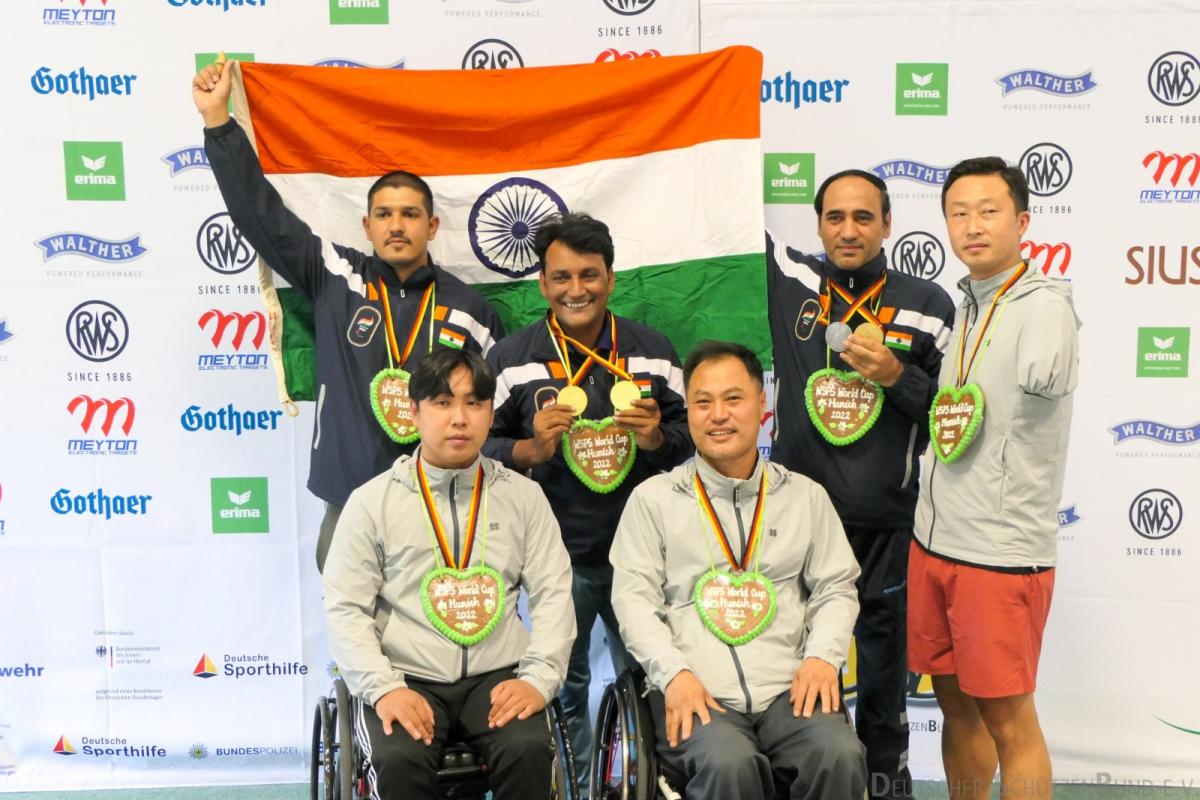 Teams celebrate their medals on podium