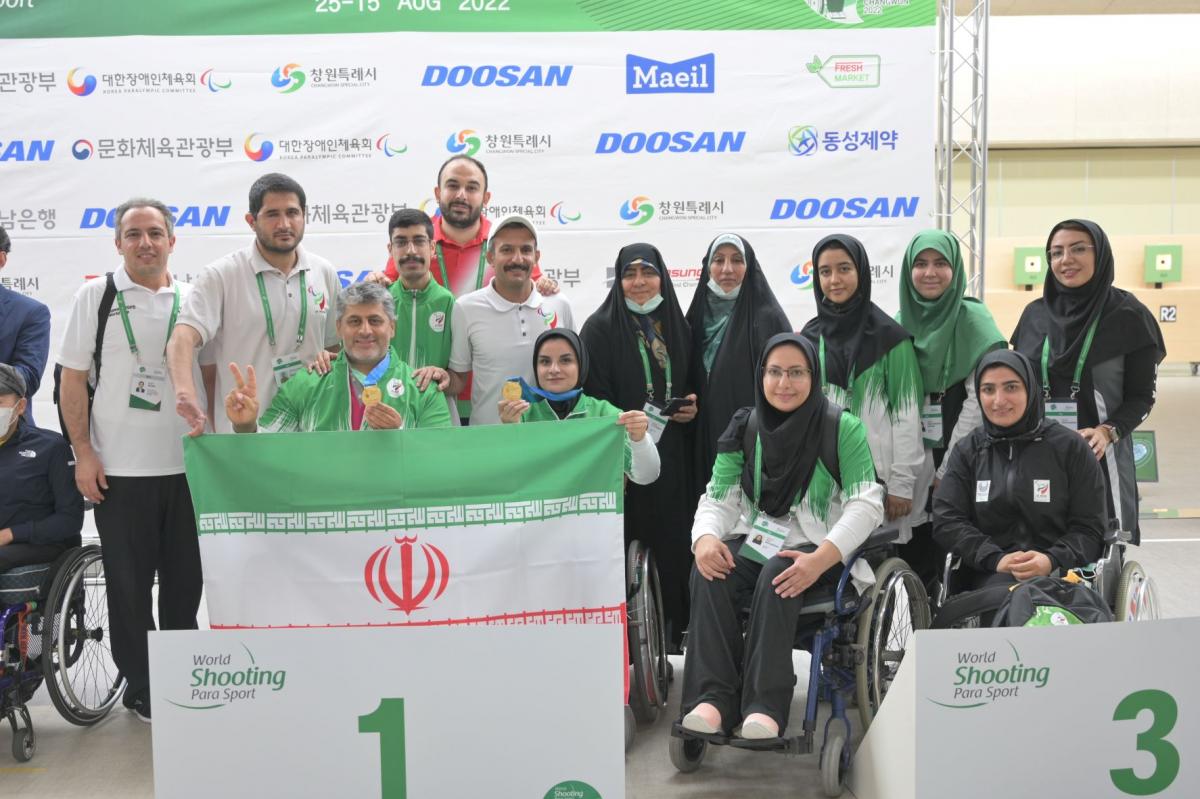 Iran team celebrate their gold medal at podium.