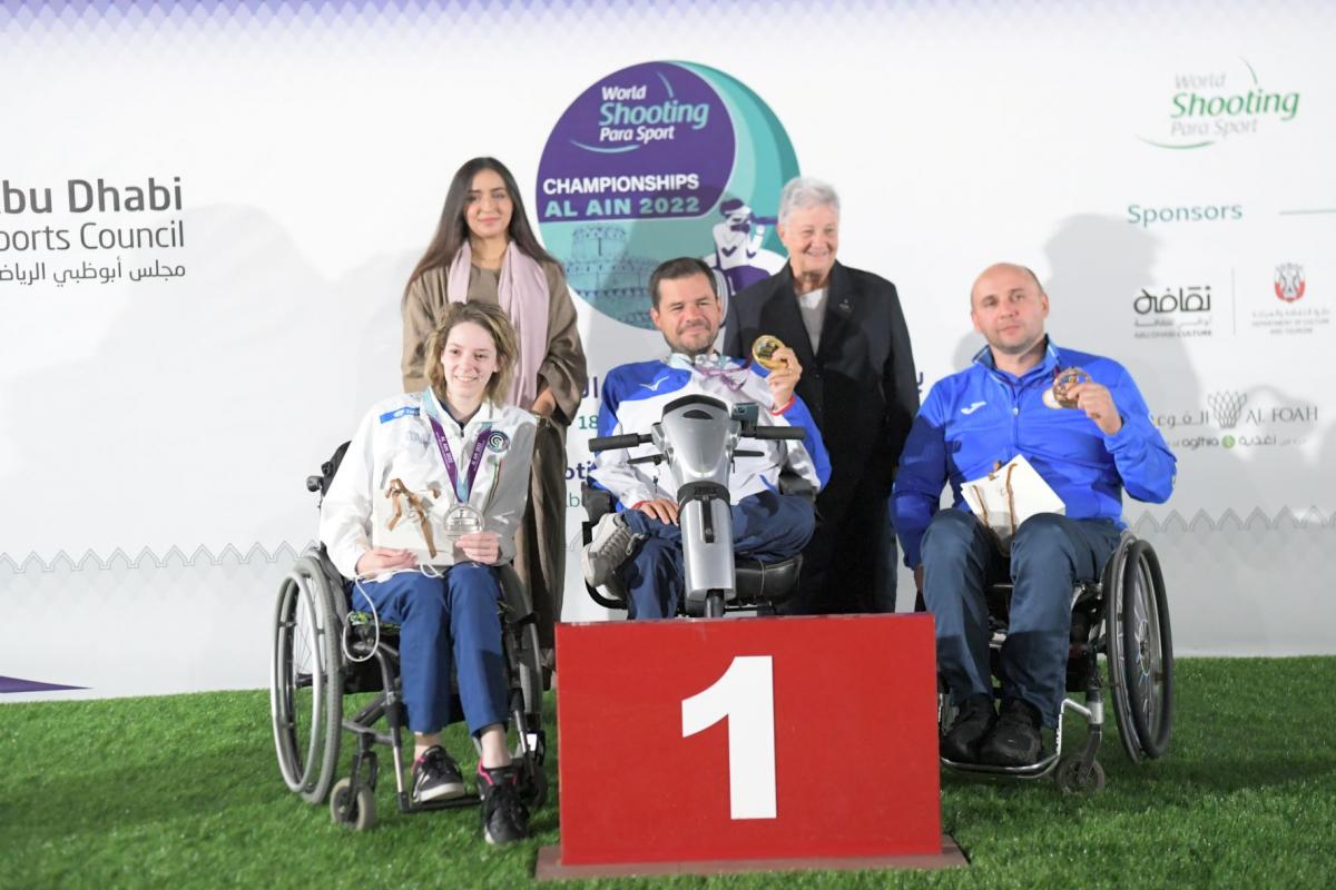 Medallists pose with their medals at the podium of R9 - mixed 50m rifle prone SH2 in Al Ain on Friday. 