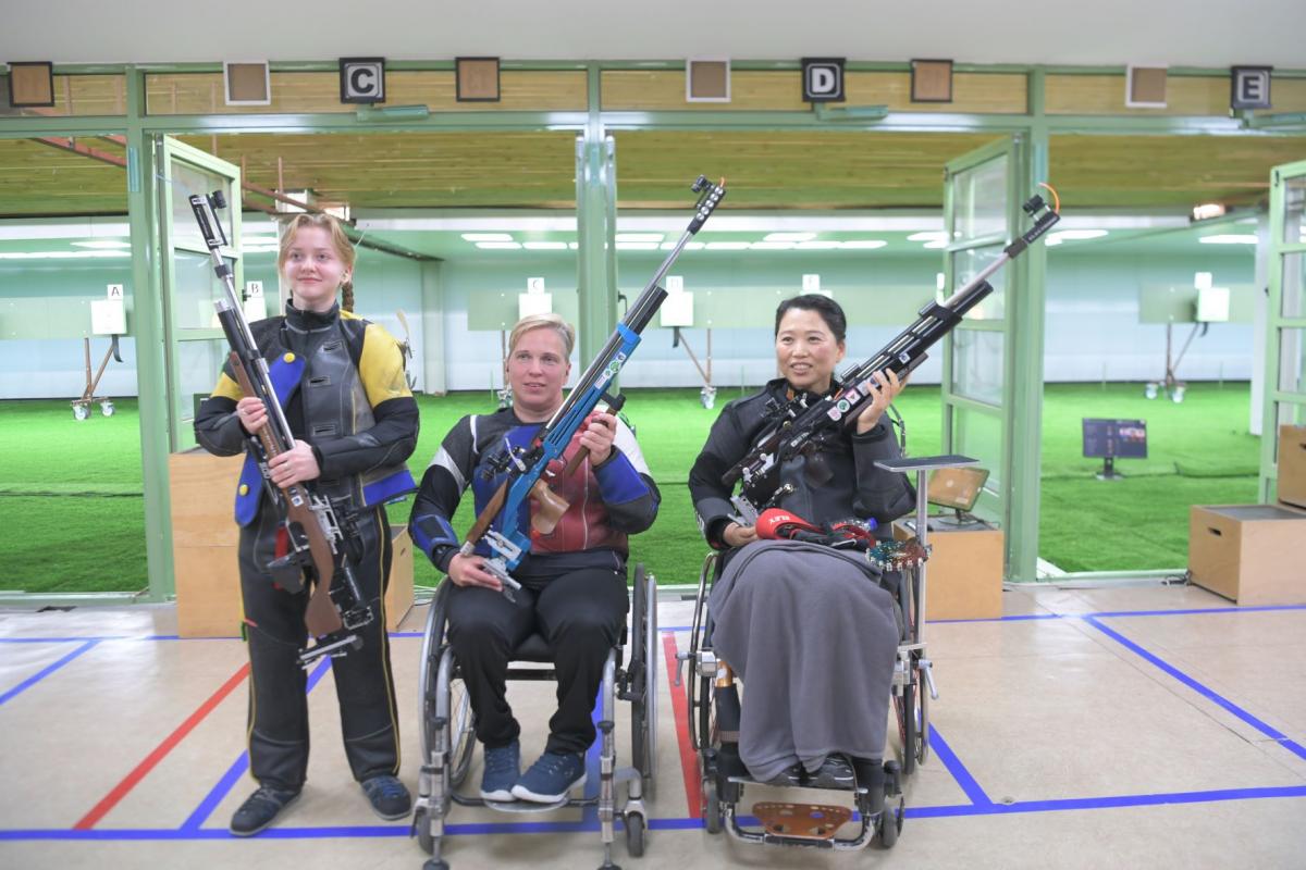 Medallists strike a pose after the end of the R2- women's 10m air rifle SH2 in Al Ain. 