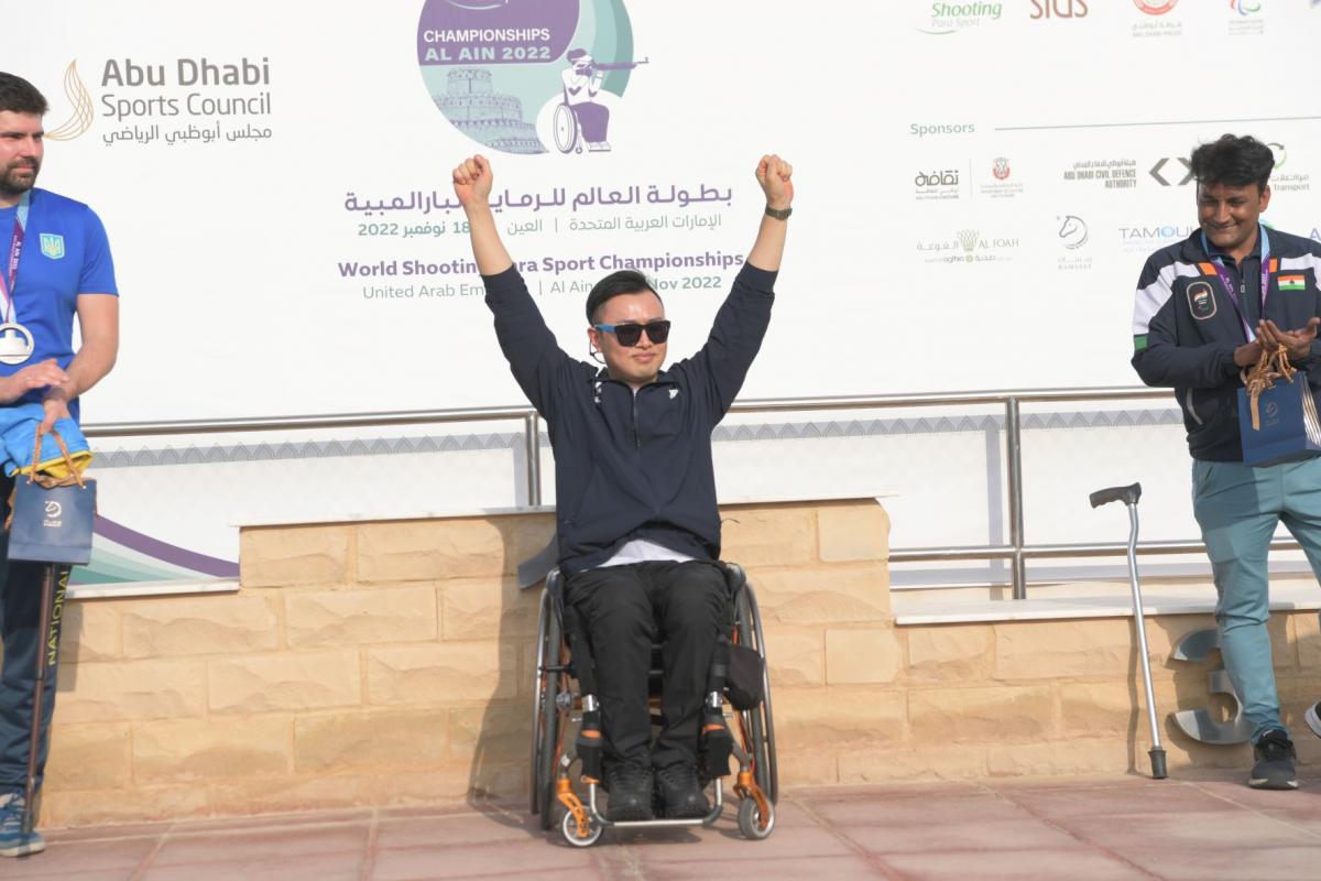  South Korea's Kim Jungnam celebrates at the podium, after his win in P3 - mixed 25m pistol SH1 final in Al Ain.