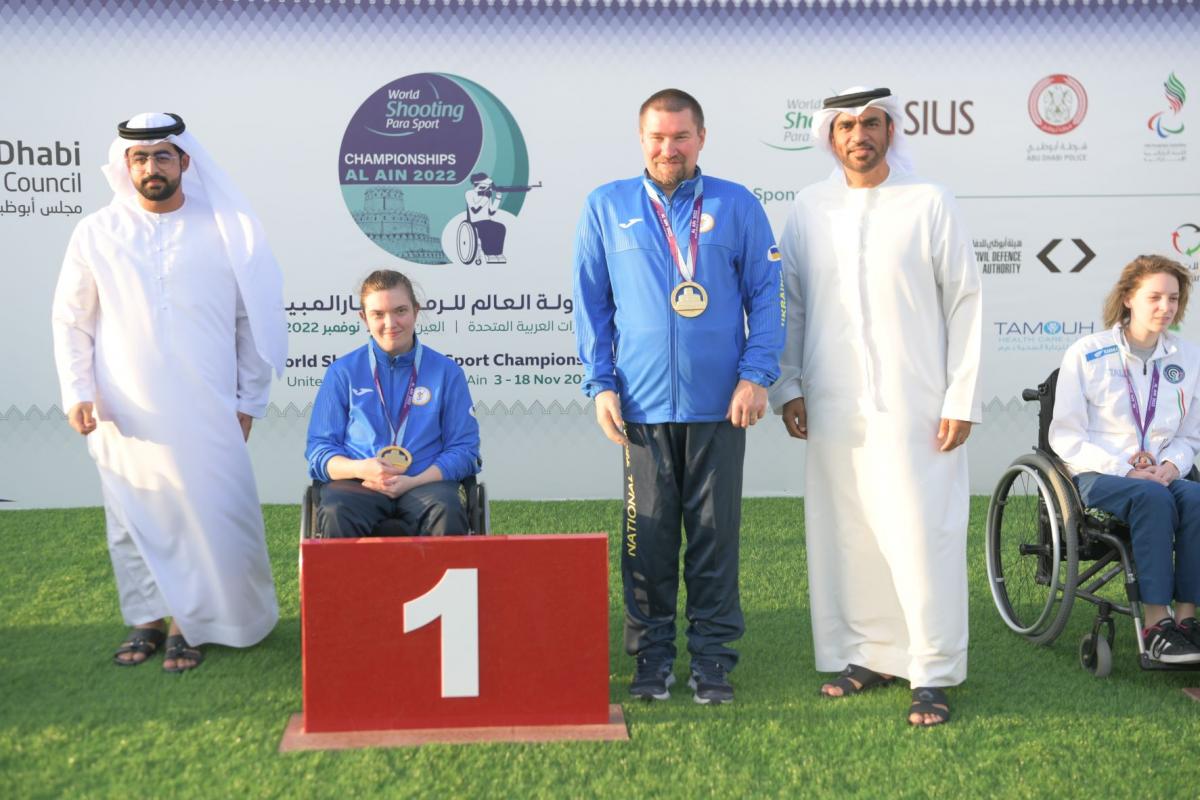 Ukraine's Vasyl Kovalchuk and Anastasiia Telizhenko pose with their gold medals at Al Ain 2022.