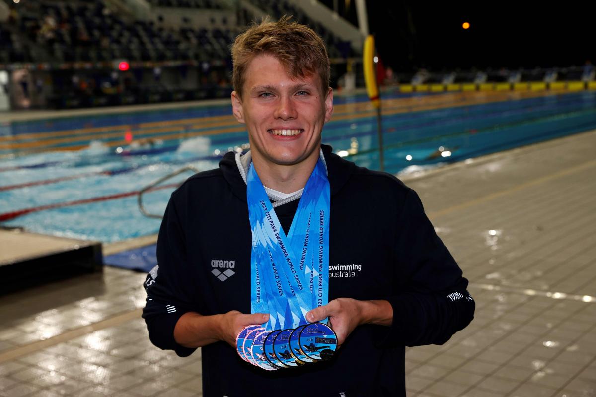 Australia's Timothy Hodge poses with his medals at the season-opening Citi Para Swimming World Series Australia 2023 .