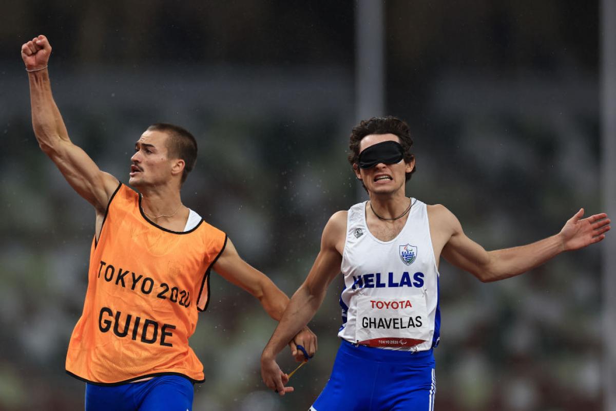 Greece's Athanasios Ghavelas celebrates with his guide Sotirios Gkaragkanis after winning gold in the men’s 100m T11 at the Tokyo 2020 Paralympic Games. 