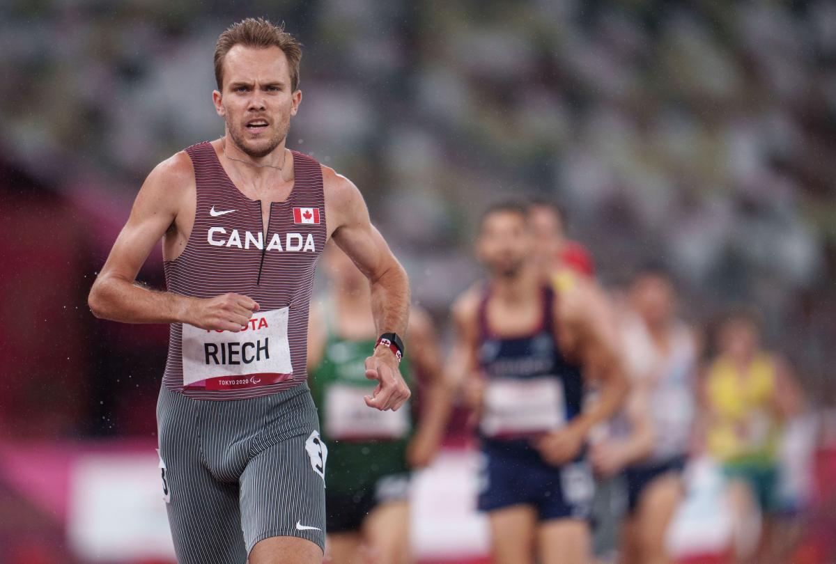 A close-up image of a male runner competing at Tokyo 2020.