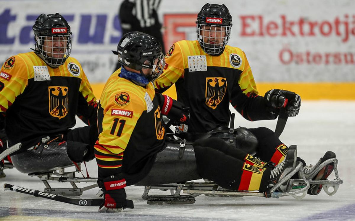 Three German Para ice hockey players on ice