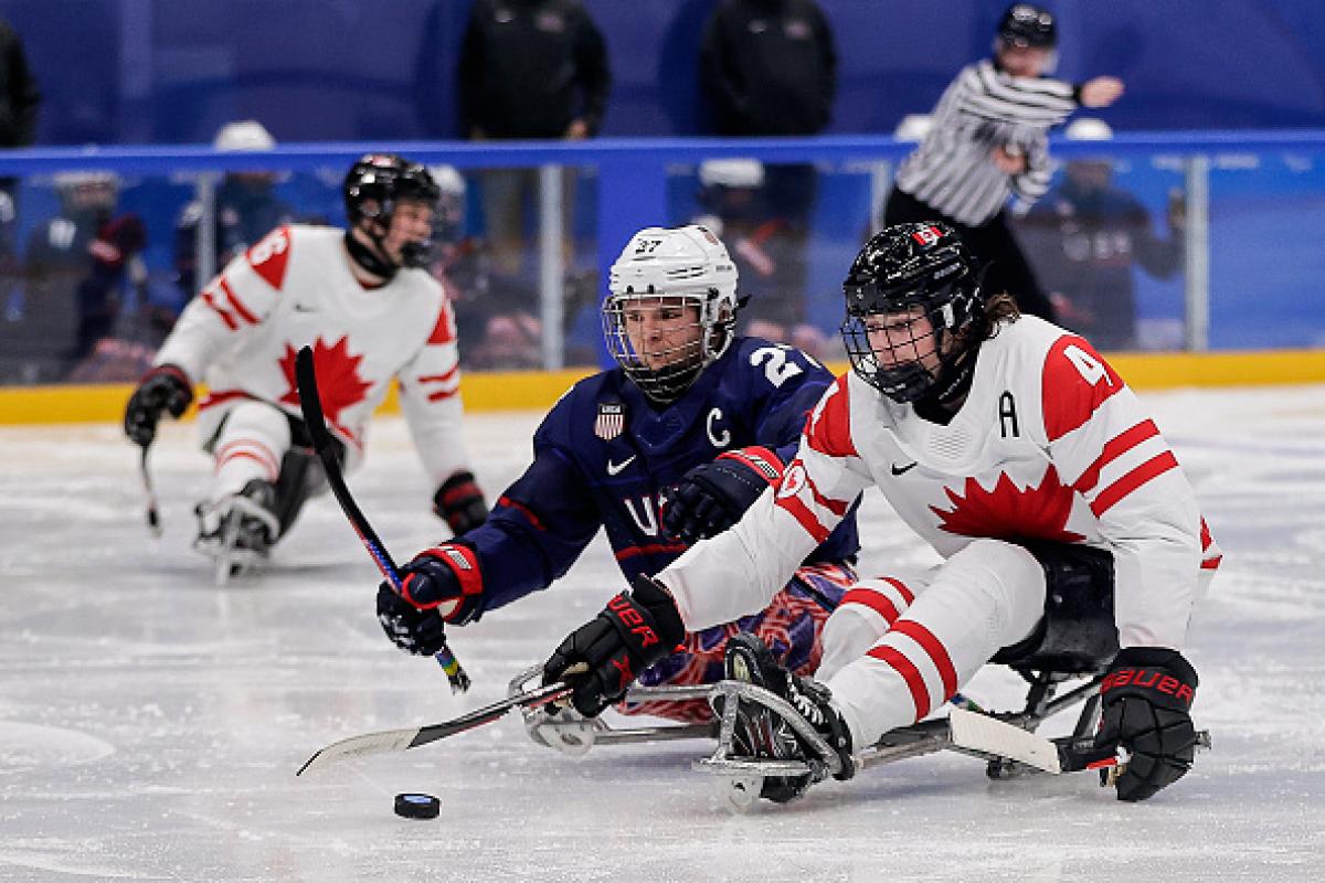 USA and Canada Para ice hockey players on ice 