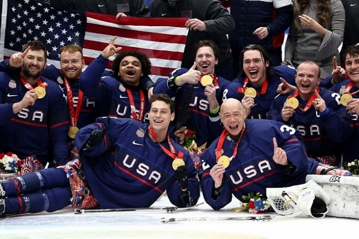 The USA Para ice hockey national team celebrating on ice