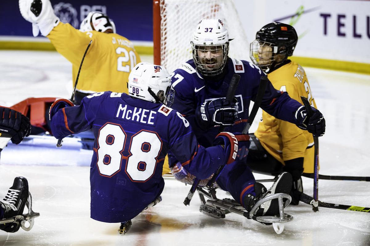 Two USA Para ice hockey players celebrating 