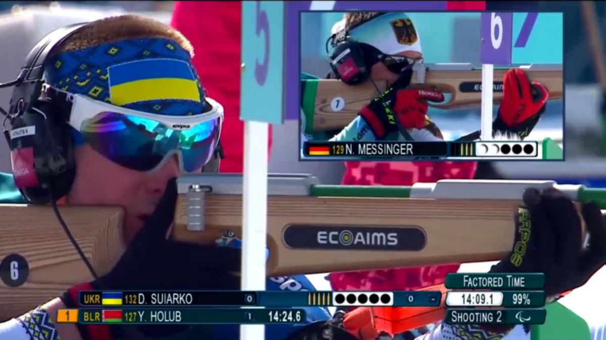 A screen showing two Para biathlon athletes shooting with their rifles during a competition