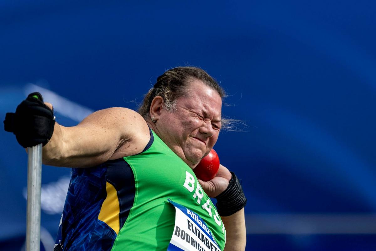 A female Para athlete competing in the shot put