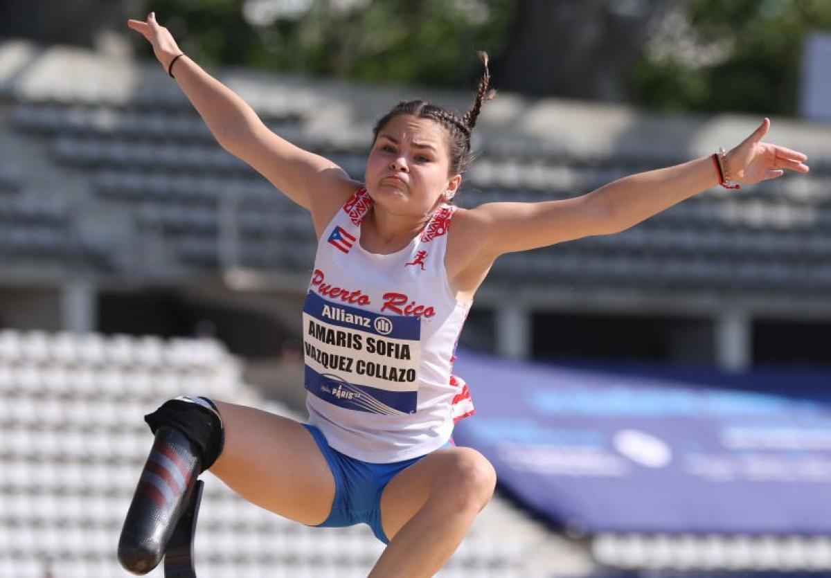 A female athlete competes in long jump.